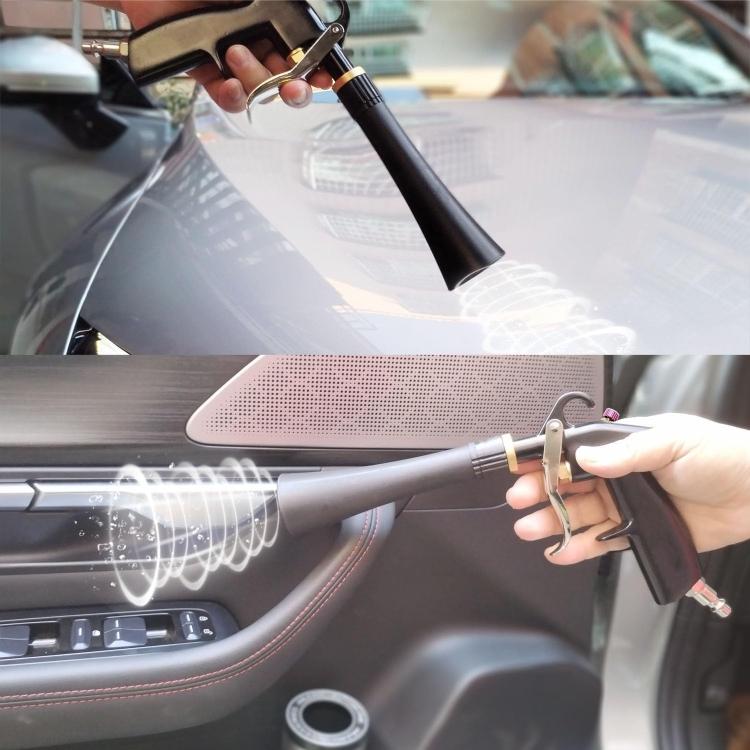 Car interior cleaning gun spraying mist toward dashboard and seat