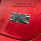 Metal car tail decoration label on red surface, rectangular time tunnel starburst design