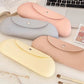 Assorted silicone makeup brush storage bags with snap buttons, laid out with brushes
