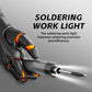 Soldering iron with orange button, shown in black-gloved hands for precise work