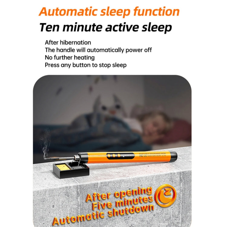Orange USB soldering iron with auto-sleep style stand, on a work surface