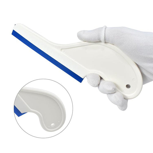 Handheld silicone scraper blade with blue strip and curved white handle, close-up