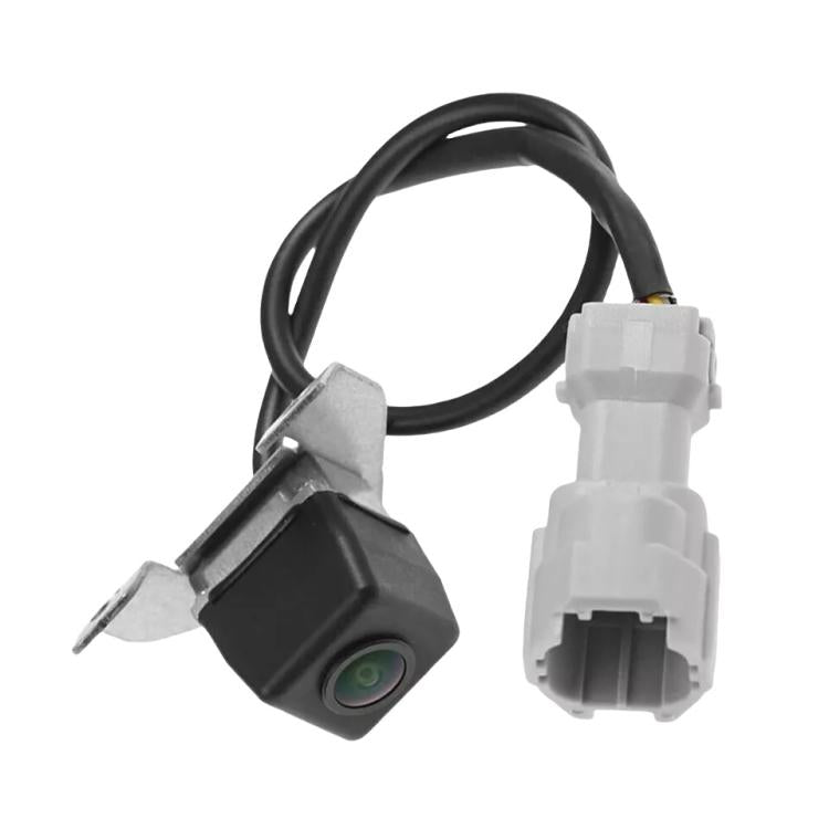 Compact rear camera with green lens, black cable and white plug connector