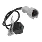 Black rear camera with green lens, bracket and white electrical connector on cable