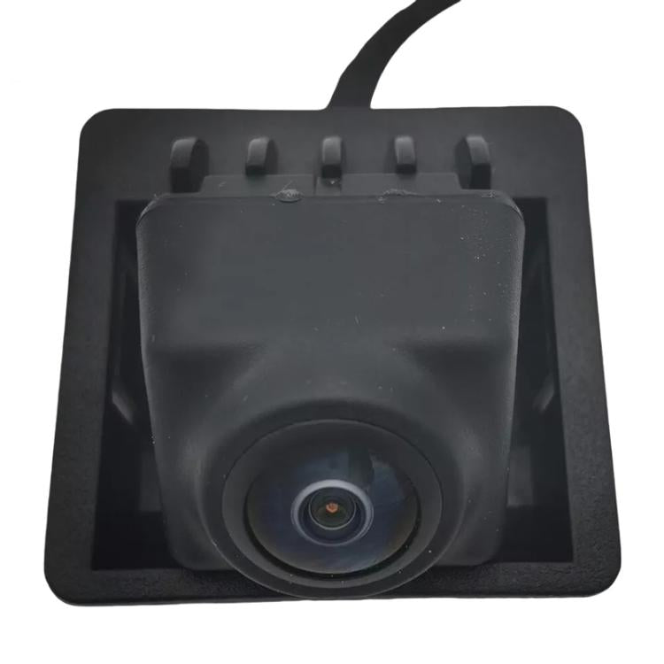 Black backup camera lens in square mounting housing