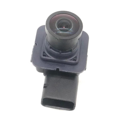 Rear view reversing camera module with circular lens and dark plastic housing