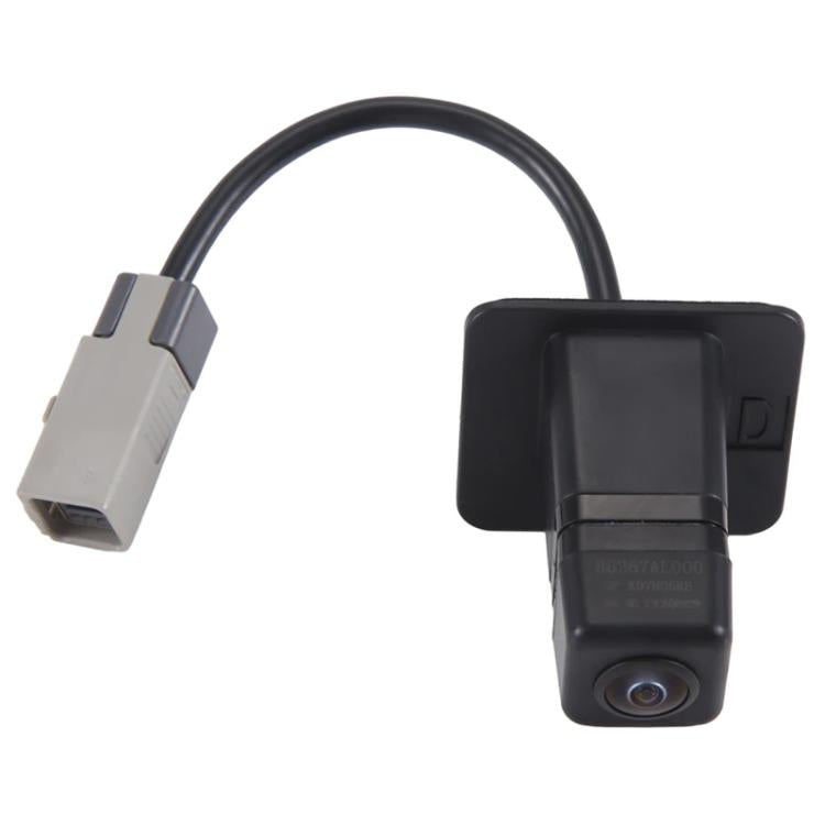 Black rear reversing camera with protective housing, cable, and gray USB-style adapter