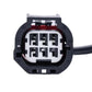 Rearview auxiliary camera connector with exposed pin terminals and black housing