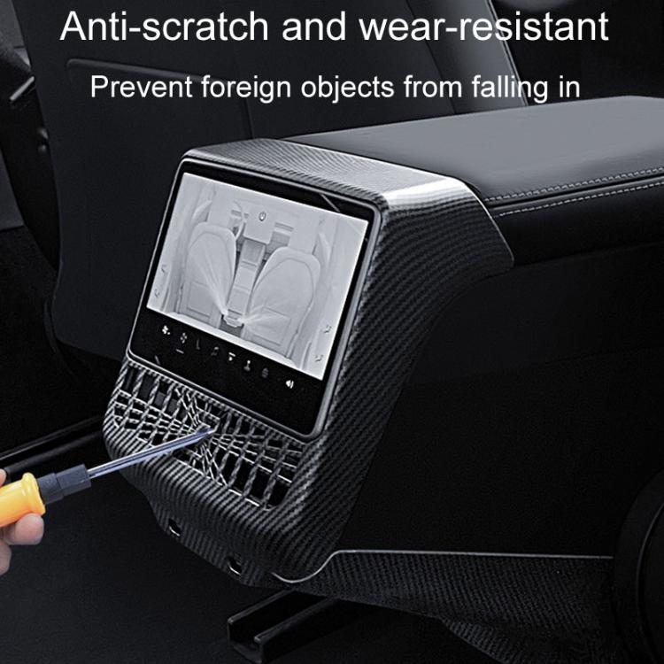 Rear air vent protection frame with carbon-fiber pattern covering the dashboard air outlet