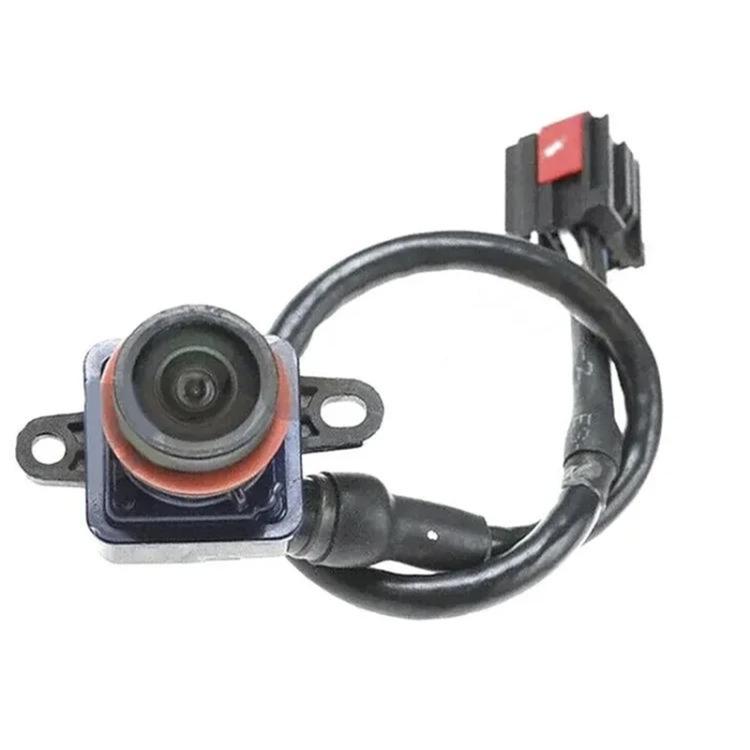 Rear view camera module with lens, metal mounting tabs, and wiring harness