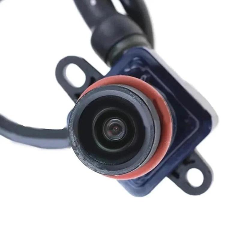 Rear view camera lens module with orange gasket ring and black mounting plate, wired