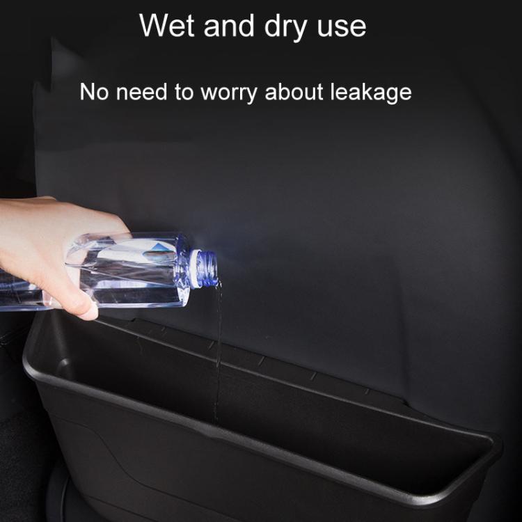 Car seat rear wet/dry storage box with water being poured in, dark gray bin