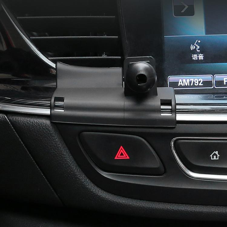 Phone navigation bracket base mounted on car dashboard near hazard button
