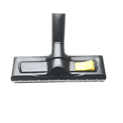 Floor cleaning brush attachment with yellow push-button on gray base