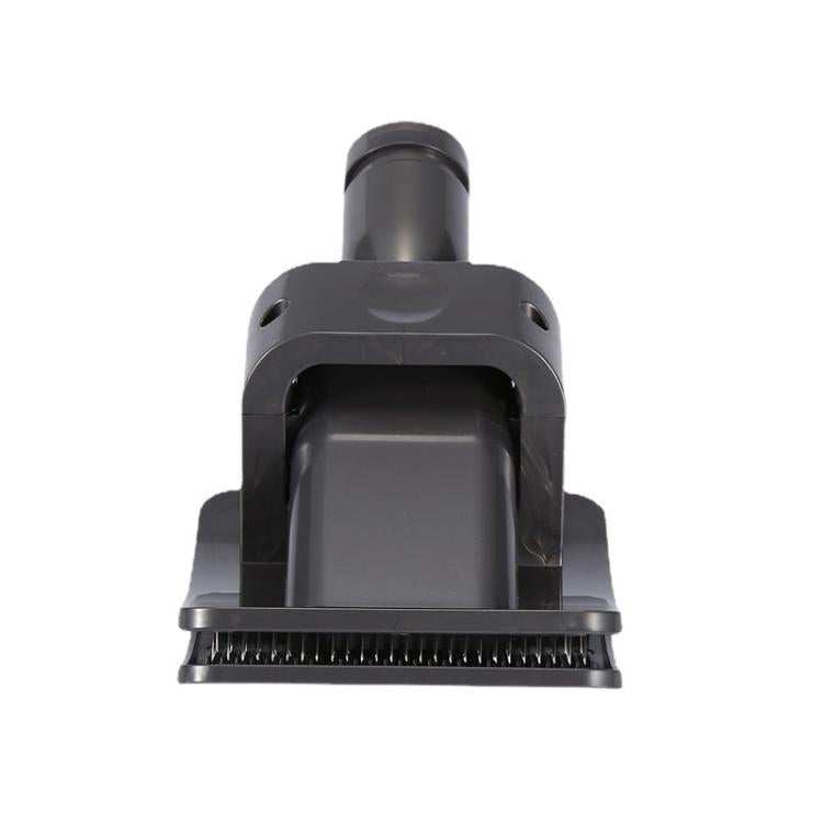 Vacuum pet hair brush attachment with wide front brush and central nozzle, dark gray