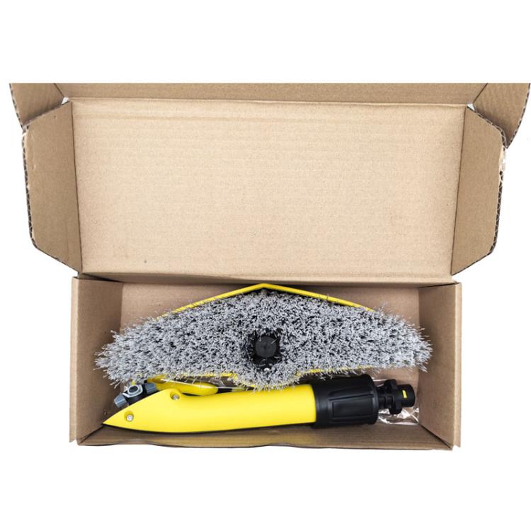 Cleaning brush kit with gray bristle head and yellow handle inside open box