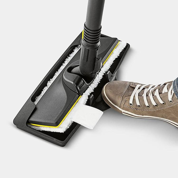 Black carpet glider base with brush roller and white cleaning pad around nozzle