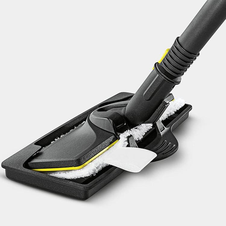 Carpet steamer nozzle on black glider base with white scrubbing pads