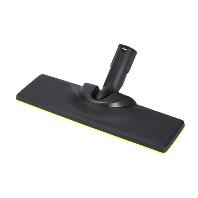 Steam floor brush head with black pad and yellow rim, angled view