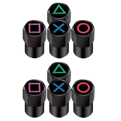 Set of black tire valve caps with colored symbols: triangle, square, X, circle