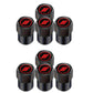 Set of black tire valve caps with red circular logo discs