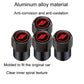 Set of black tire valve caps with red oval logo on round top