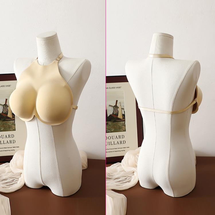 Beige breast pad inserts on mannequin with back straps and molded cups