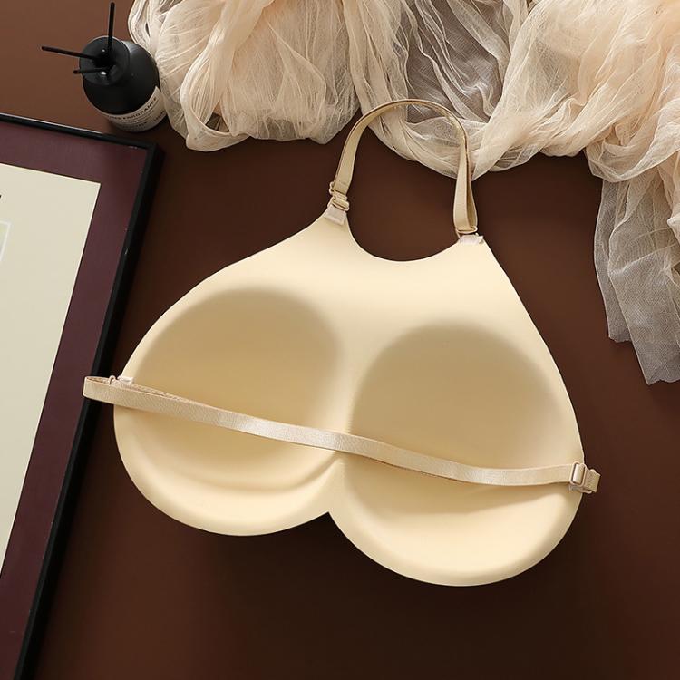 Beige molded breast cups with wide center strap and underbust strap