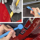 Hands applying car film with blue squeegee tool and trimming scraper edge tools