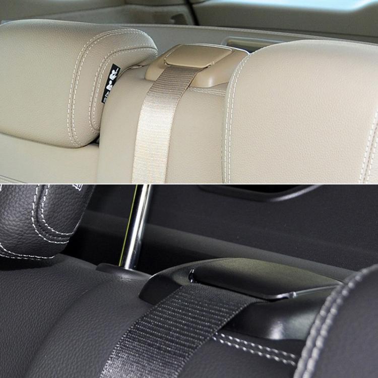 Rear seat belt cover guide installed on car seat belt, dark interior view