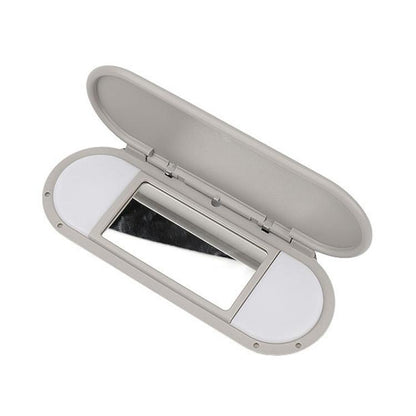 Gray car sun visor vanity mirror, open lid with rectangular mirror opening