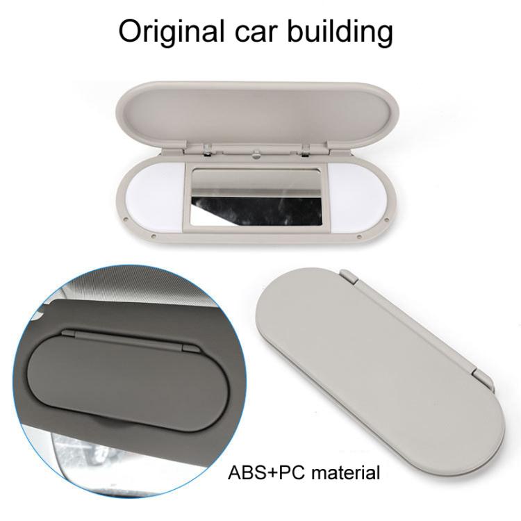 Gray car sun visor vanity mirror, open visor with mirror window and cutout