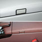 Installed car center armrest switch on leather panel, rectangular dark bezel