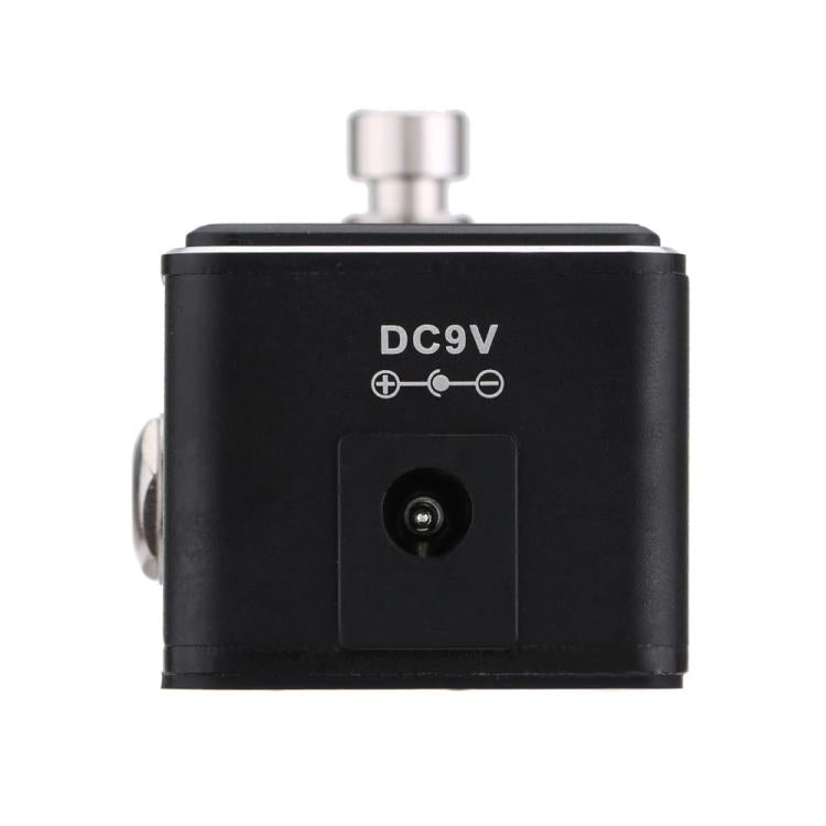 Black tuner pedal back panel with DC9V label and round power input