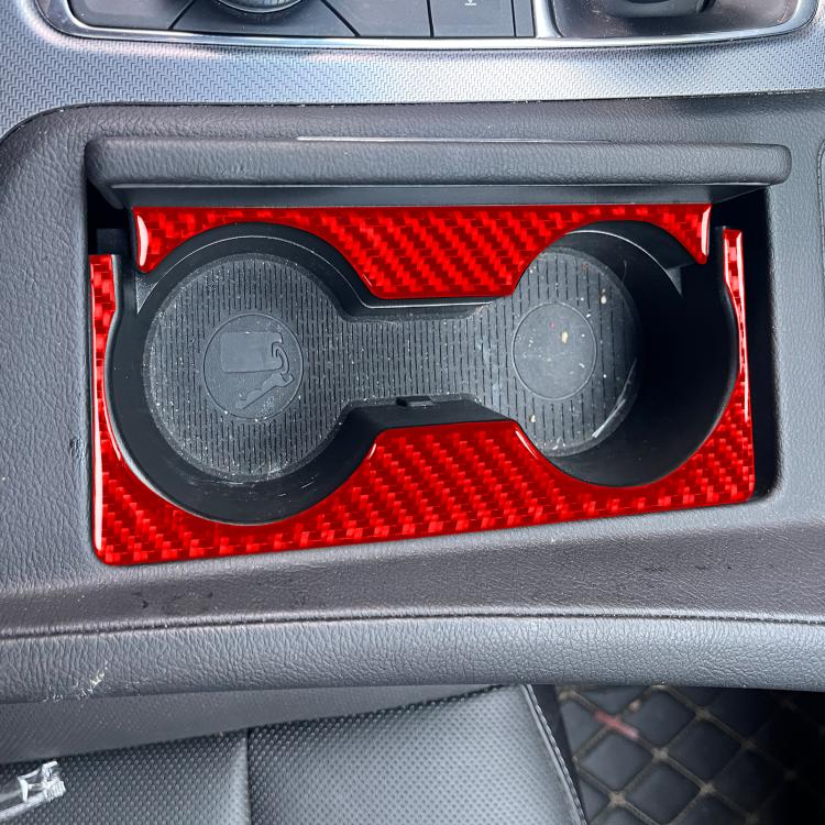 Red carbon-fiber gear shift cup holder trim with two circular openings installed