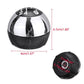 Round gear shift knob with black top, chrome sides, and visible R gear label