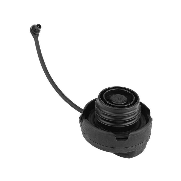 Black fuel tank cap with circular filler opening and flexible tether cord
