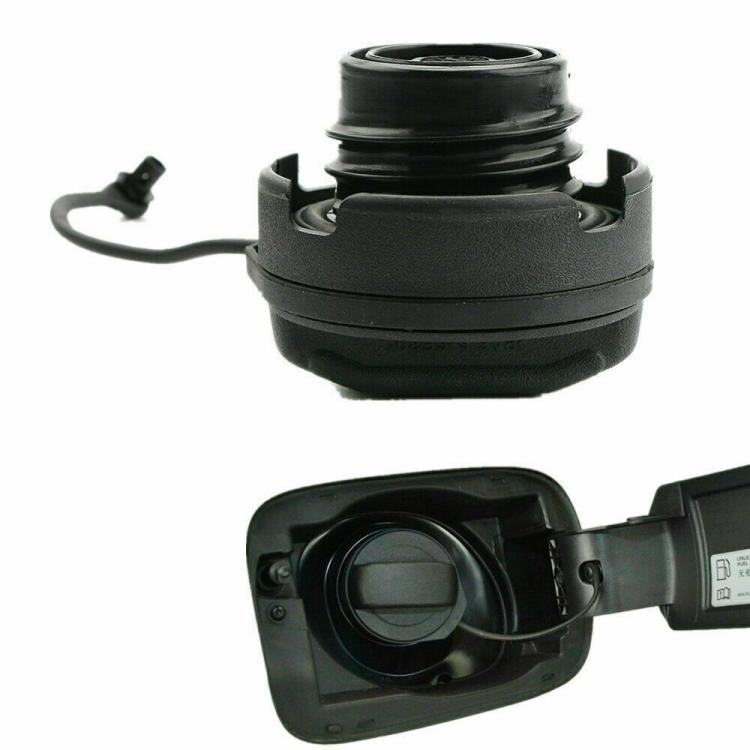 Black fuel tank cap with rubber seal, tether cord, and open cap cover