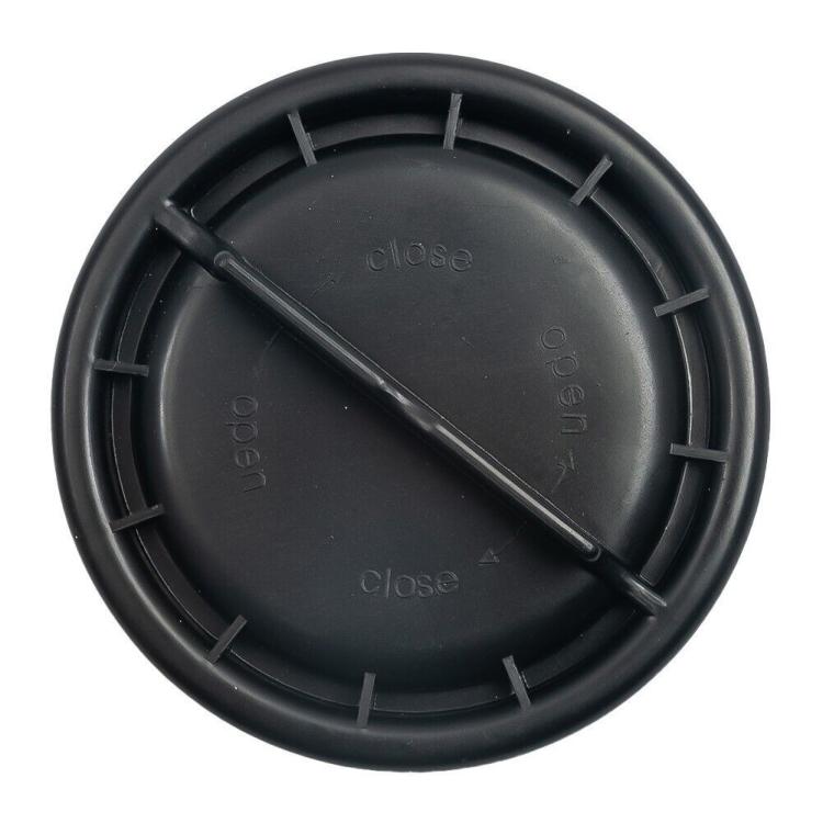 Headlight dust cover underside, black round cap with internal flap and alignment ribs