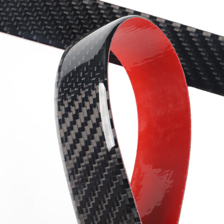 Close-up of red edge on carbon-fiber style door sill decoration sticker