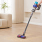 Vacuum floor brush attachment picking up debris on wood flooring