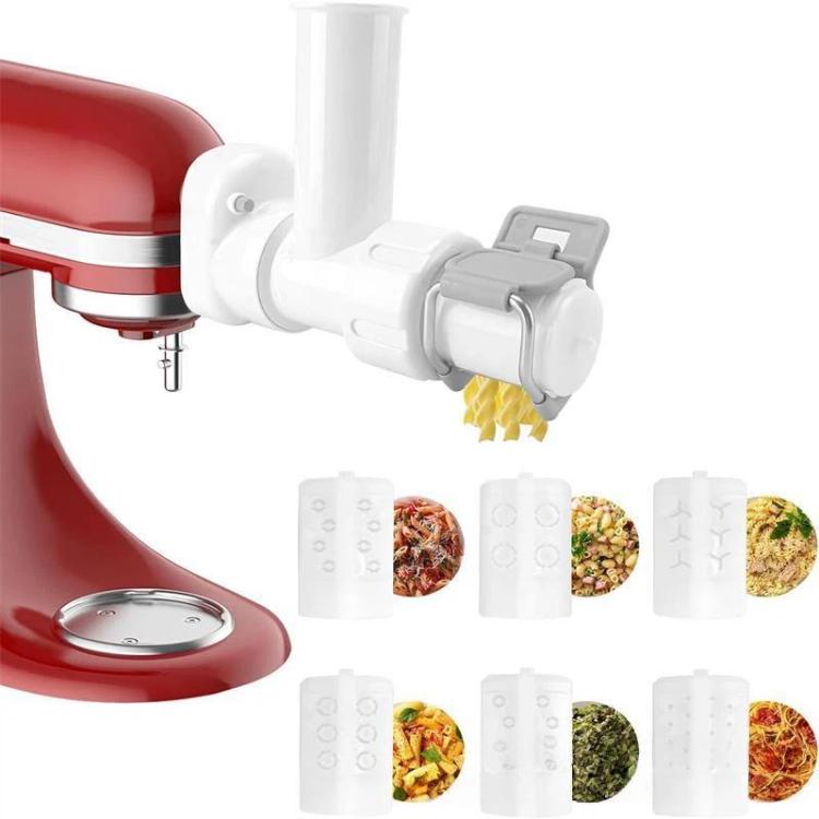 KitchenAid pasta maker attachment extruding yellow macaroni noodles from outlet