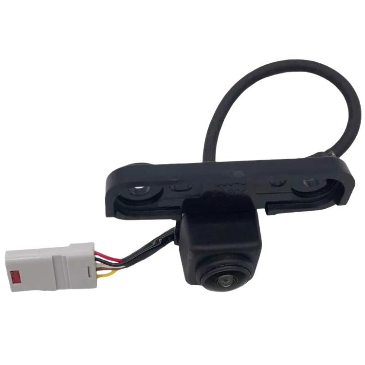 Front parking assist camera with black housing and wiring harness, front view