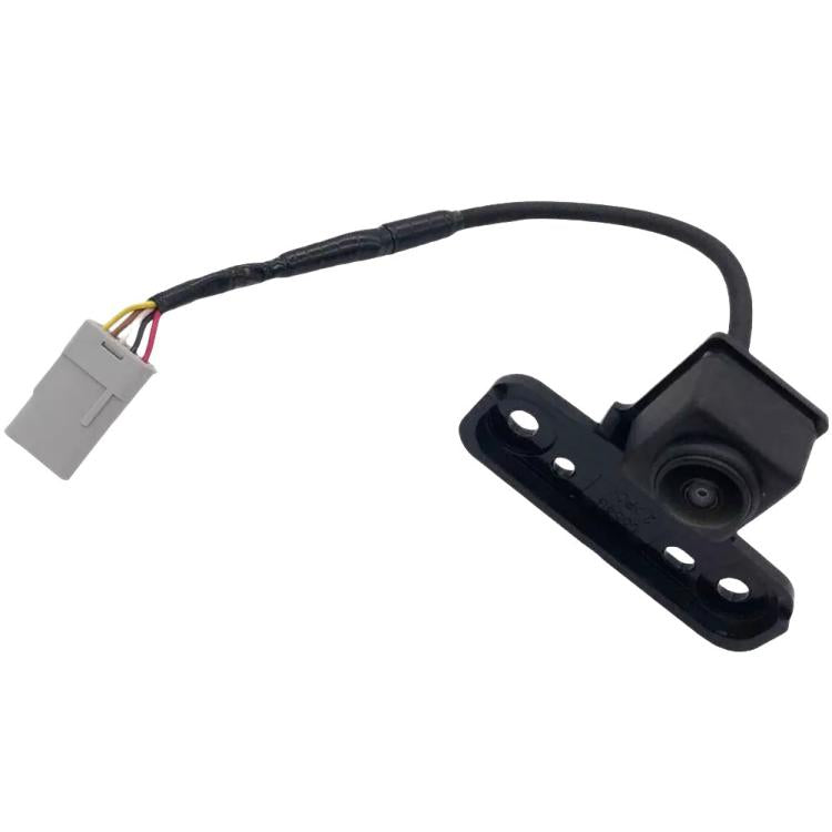 Parking assist camera with lens and black mounting plate, wire harness attached