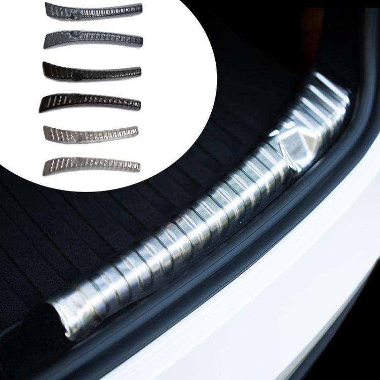 Stainless steel trunk sill guard on car sill with silver ribbed sections and black base