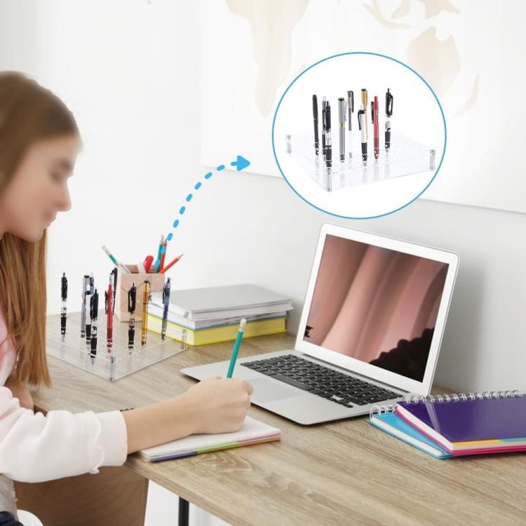 Clear acrylic 120-hole organizer holding pens and paintbrushes on a desk
