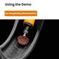 Tire grinding head for repair, brown abrasive disc mounted on metal rod in tread