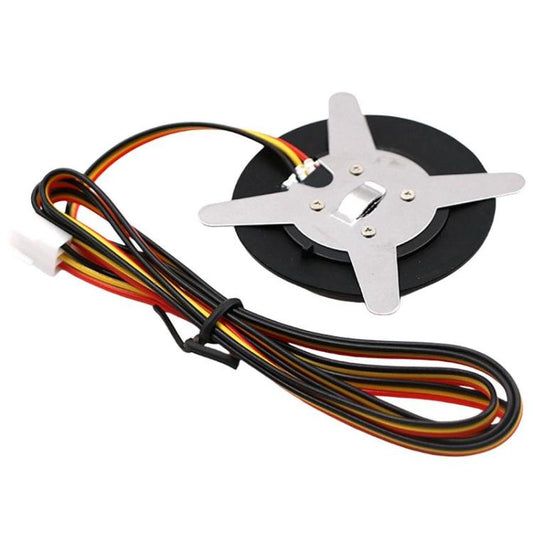 Car engine start-stop button with black base, star terminals, and wire leads