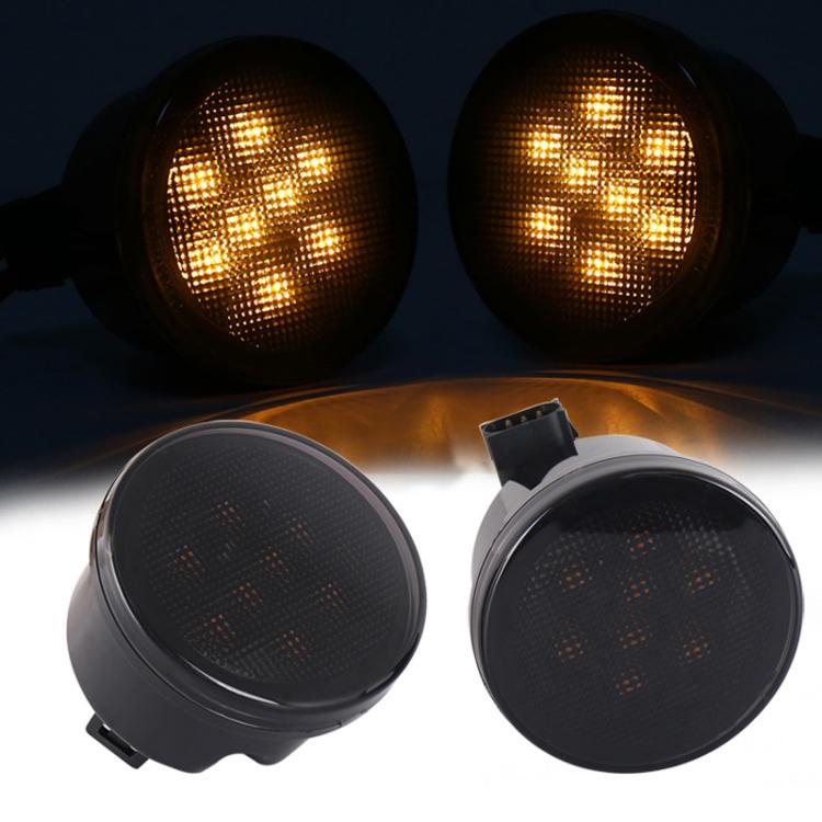 Pair of amber LED grille turn signal lights, black housing, circular lens