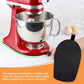 Black oval rubber non-slip mat placed under stand mixer base